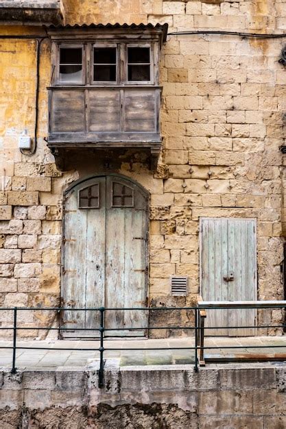 Premium Photo Traditional Houses With Colorful Wooden Balconies In Malta