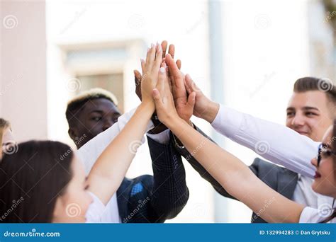 Happy Successful Multiracial Business Team Giving A High Fives Gesture