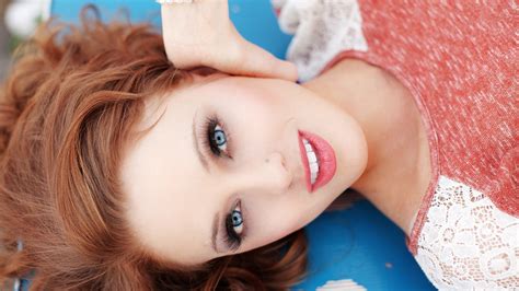 Redhead Model Pierced Nose Lying On Back Looking At Viewer Makeup