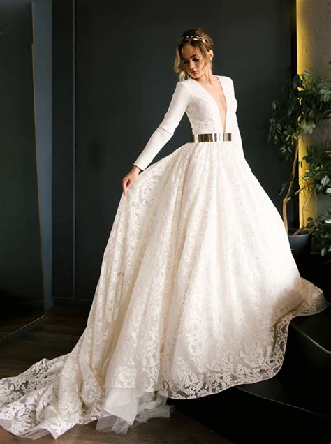 Modest Illusion Plunging Neckline Long Sleeve Lace Wedding Gown With Metallic Belt