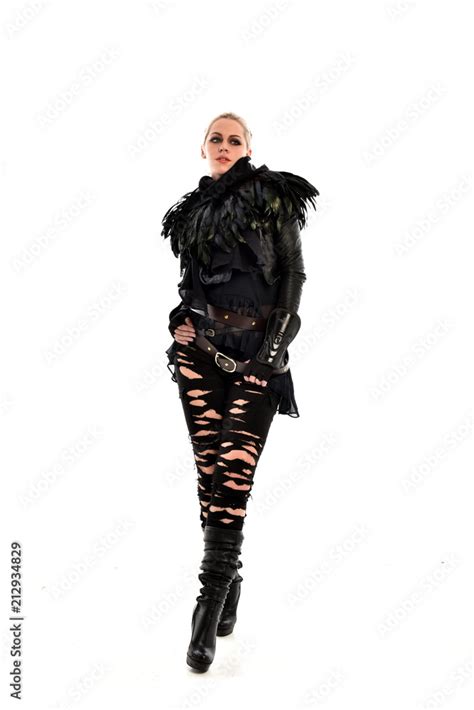 Full Length Portrait Of Blonde Girl Wearing Torn Black Feather Costume Standing Pose Isolated