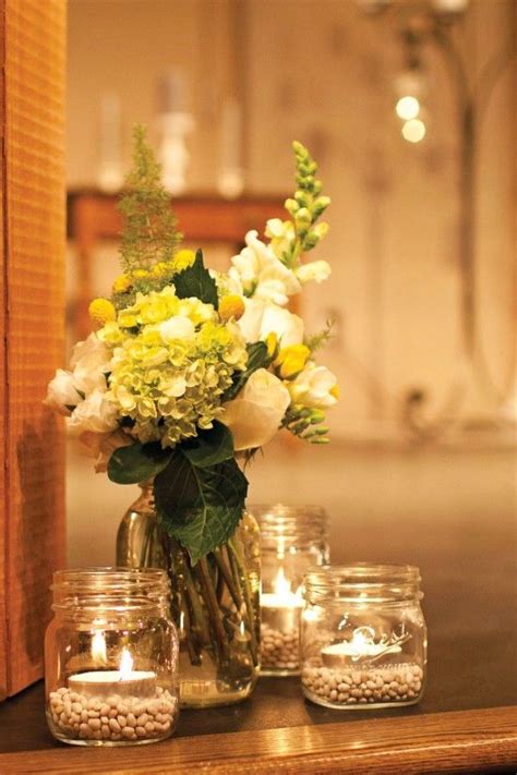 Clear Jars With Flowers And Tea Lights Vintage Wedding Flowers Mason