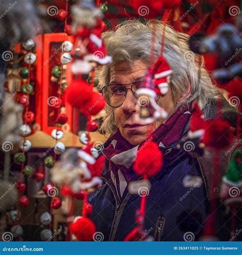 Tired New Year Toys Seller at the Christmas Market in Munich, Germany