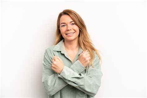 Premium Photo Smiling Cheerfully And Celebrating With Fists Clenched