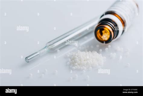 Homeopathic Globules In Small Bottle Homeopathy Concept Stock Photo