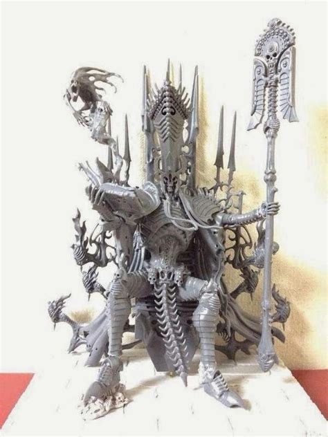 A Metal Sculpture Of A Man With Many Arms And Legs Standing On A White