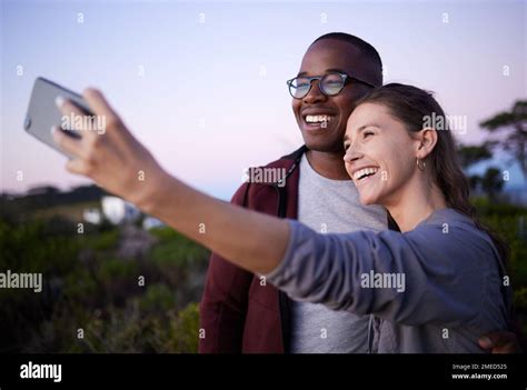 Interracial Couple Phone And Smile For Selfie Journey Or Travel