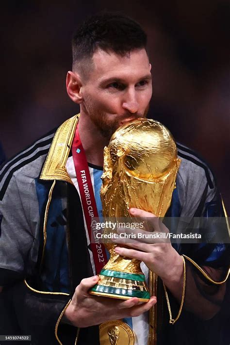 Lionel Messi Of Argentina Kisses The Fifa World Cup Trophy During The