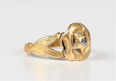 A Victorian Gold And Diamond Single Stone Ring Mounted With A Cushion