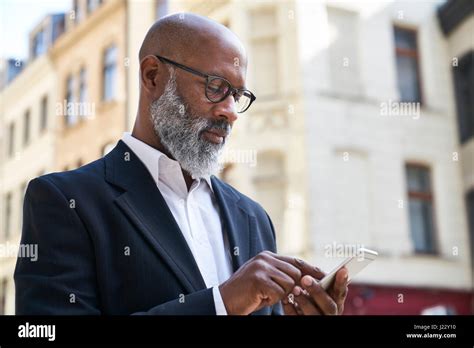 Mature Businessman Using Smartphone Stock Photo Alamy