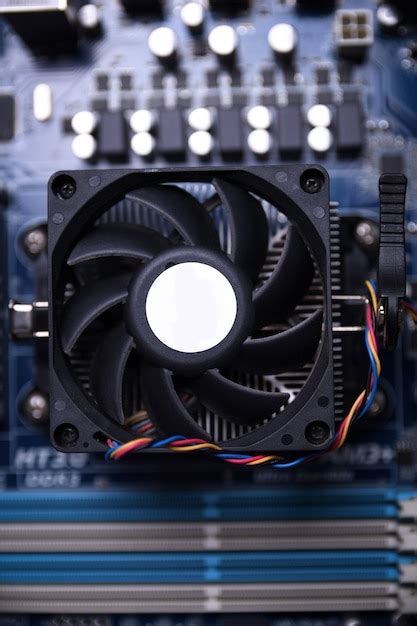 Premium Photo Computer Fan On Motherboard And Electronical Components