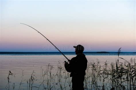 Fisherman Silhouette At Sunset Stock Photo Image Of Reel Black