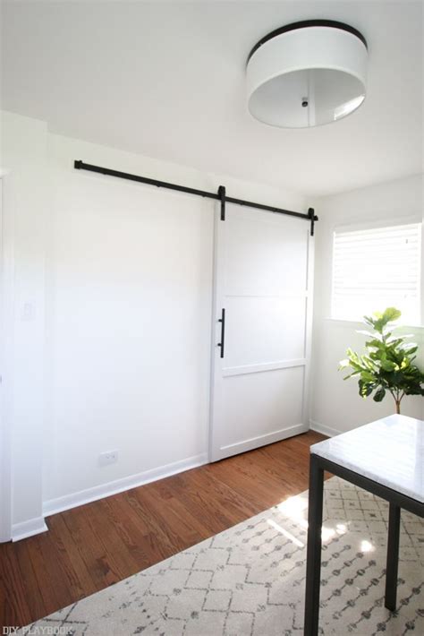 How To Hang A Barn Door In Your Home Diy Diy Playbook Inside Barn Doors Interior Barn Doors