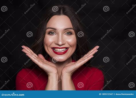 Emotional Head Shot Portrait Of A Brunette Caucasian Woman In Red Dress