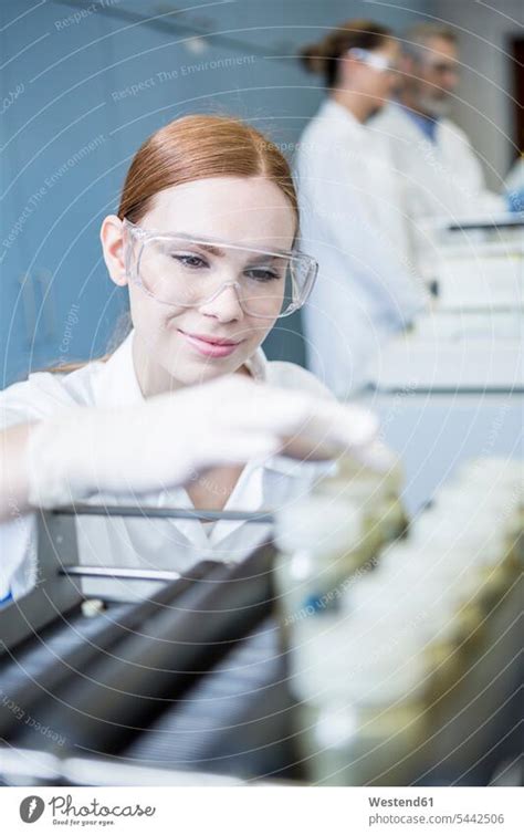 Smiling Scientist In Lab With Samples A Royalty Free Stock Photo From