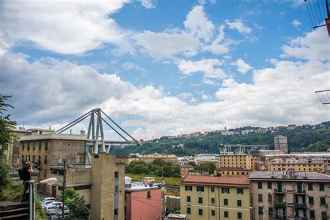 The City Is Surrounded By Tall Buildings And Hills In The Distance