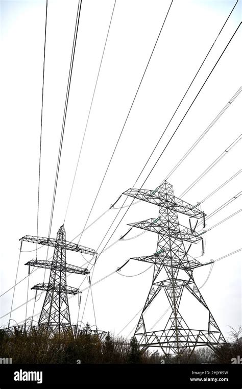 Two Electricity Pylons And Powerlines Against The Sky Stock Photo Alamy