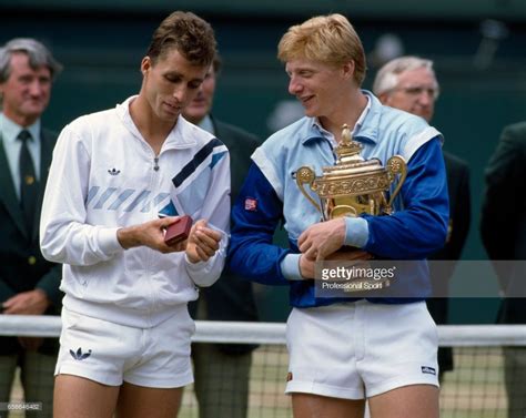 Boris becker of west germany holds the trophy after defeating ivan ...