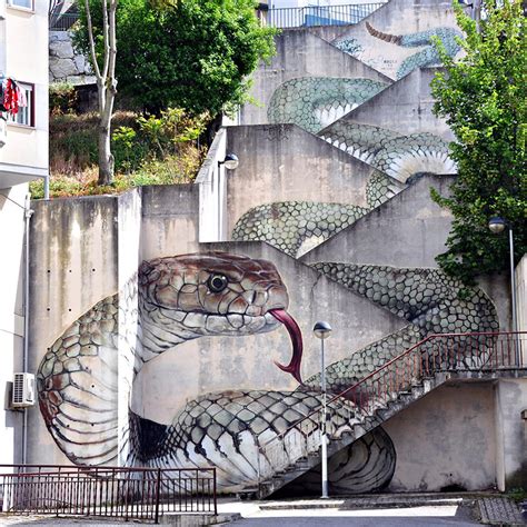 a giant snake moves down a massive staircase in this graffiti by SFHIR ...