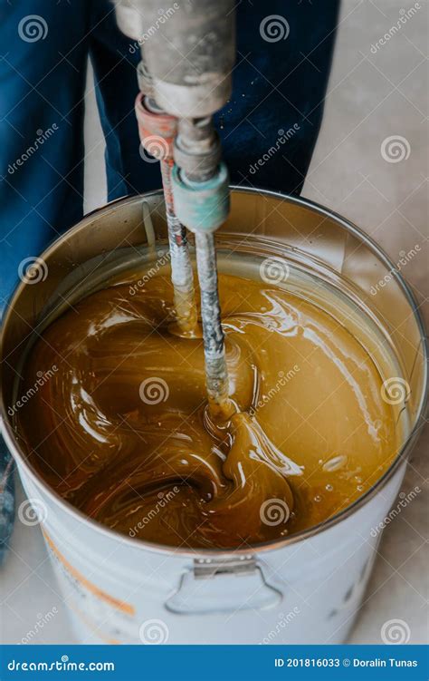 Worker Mixing Yellow Epoxy Resin With The Mixer Stock Image Image Of