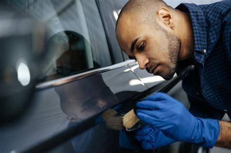 Premium Photo African American Man Car Service Worker Applying Nano