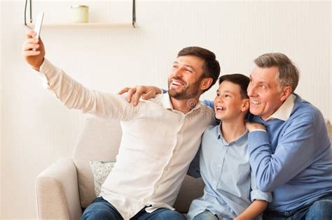 Mature Man Son And Senior Father Taking Selfie At Home Stock Photo Image Of Elderly Portrait