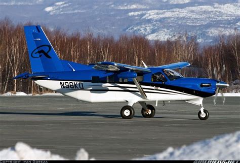 A Small Blue And White Plane Sitting On Top Of An Airport Tarmac