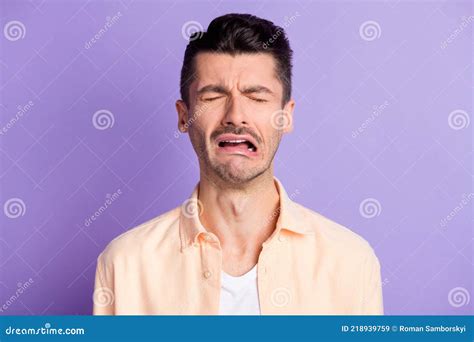 Portrait Of Sad Crying Brunet Hair Guy Wear Peach Shirt On Lilac Color