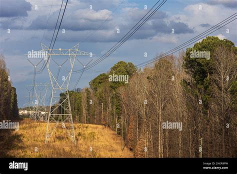 Electricity Transmission Towers Are Lined Up In A Row In A Residential