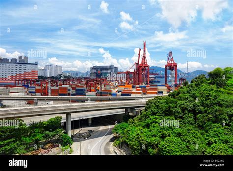 Port Warehouse With Containers And Industrial Cargoes At Day Stock