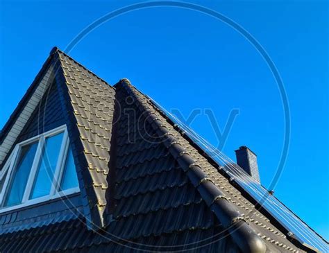 Image Of Solar Panels Producing Clean Energy On A Roof Of A Residential