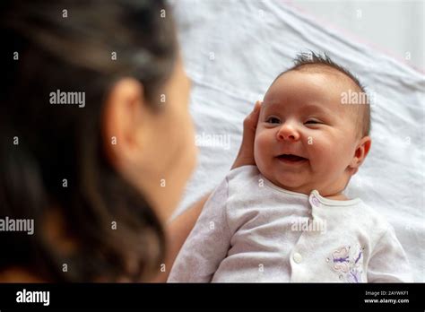 Newborn Baby In Mothers Arms Top View Stock Photo Alamy