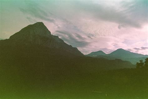Forest Valley Between Tall Rocky Mountains With Snow · Free Stock Photo