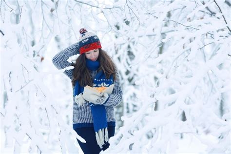 Premium Photo | Girl adult tangerine winter snow the concept of vitamins immunity