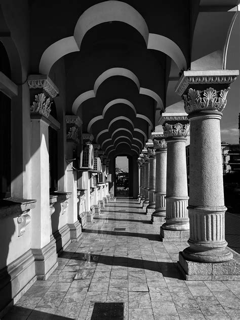 Grayscale Photo Of Multi Arch Pathway · Free Stock Photo