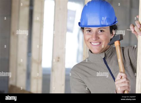 Female Worker Using A Hammer Stock Photo Alamy