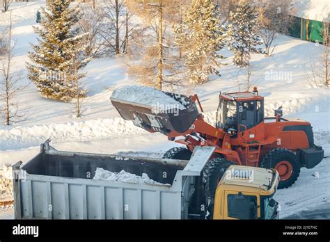 Cleaning and cleaning of roads in the city from snow in winter Stock ...