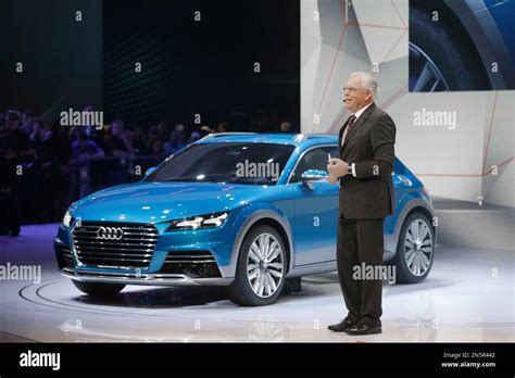 Audi Chief Technical Officer Ulrich Hackenberg Stands Next To The Audi