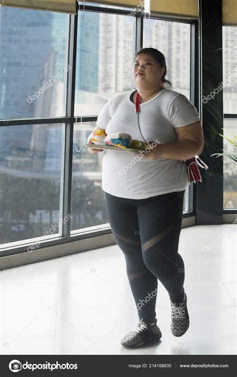 Full Length Obese Woman Carrying Foods Walking Restaurant Stock Photo