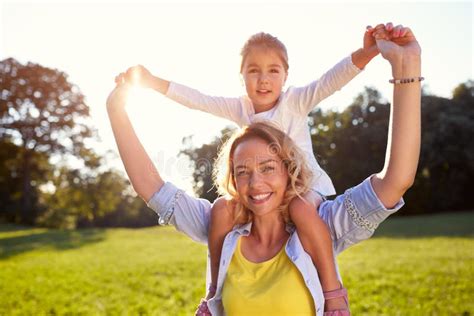 Mother With Daughter On Shoulders Stock Photo Image Of Daughter