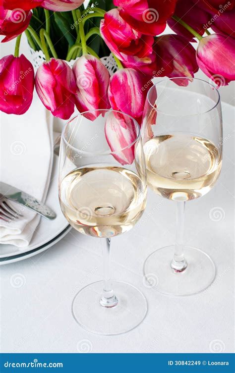 Two Glasses Of White Wine On A Table Stock Image Image Of Flowers