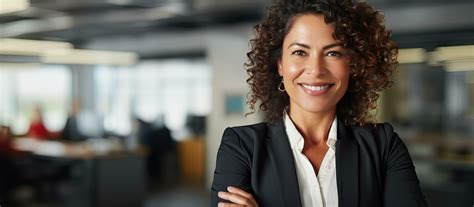 Middle Aged Latina Businesswoman Confident And Attractive Standing In An Office Setting With
