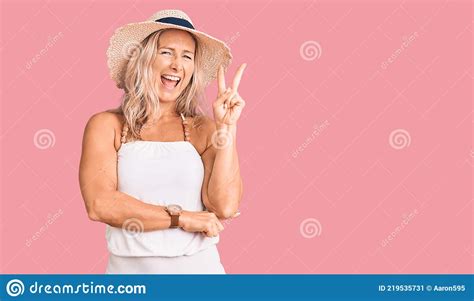 Middle Age Fit Blonde Woman Wearing Summer Hat Smiling With Happy Face