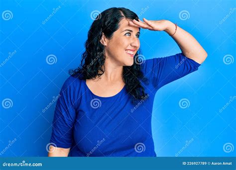 Plus Size Brunette Woman Wearing Casual Blue Shirt Very Happy And Smiling Looking Far Away With