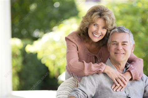 Senior Couple Hugging On Patio Stock Image F014 0825 Science