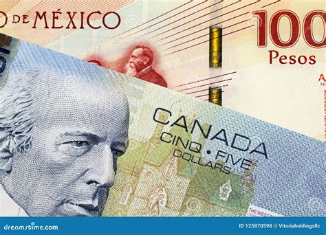 A Canadian 5 Dollar Bill With A Mexican 100 Peso Note Stock Photo