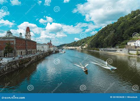 Boats Cruising Over the Danube River Against the City and Forest of ...