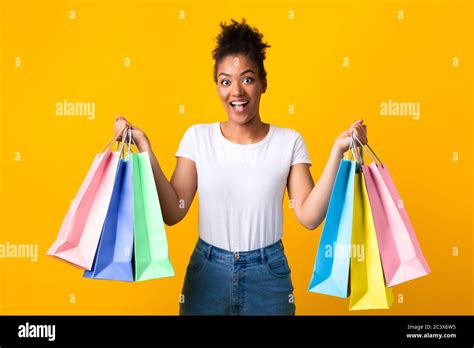 Portrait Of Cheerful Black Woman Holding Shopping Bags Stock Photo Alamy