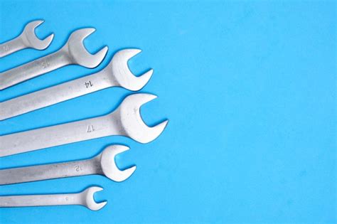 Premium Photo Set Of Wrenches On A Blue Background