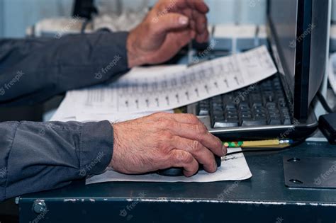 Premium Photo Overworked Hands Of An Age Worker At A Computer